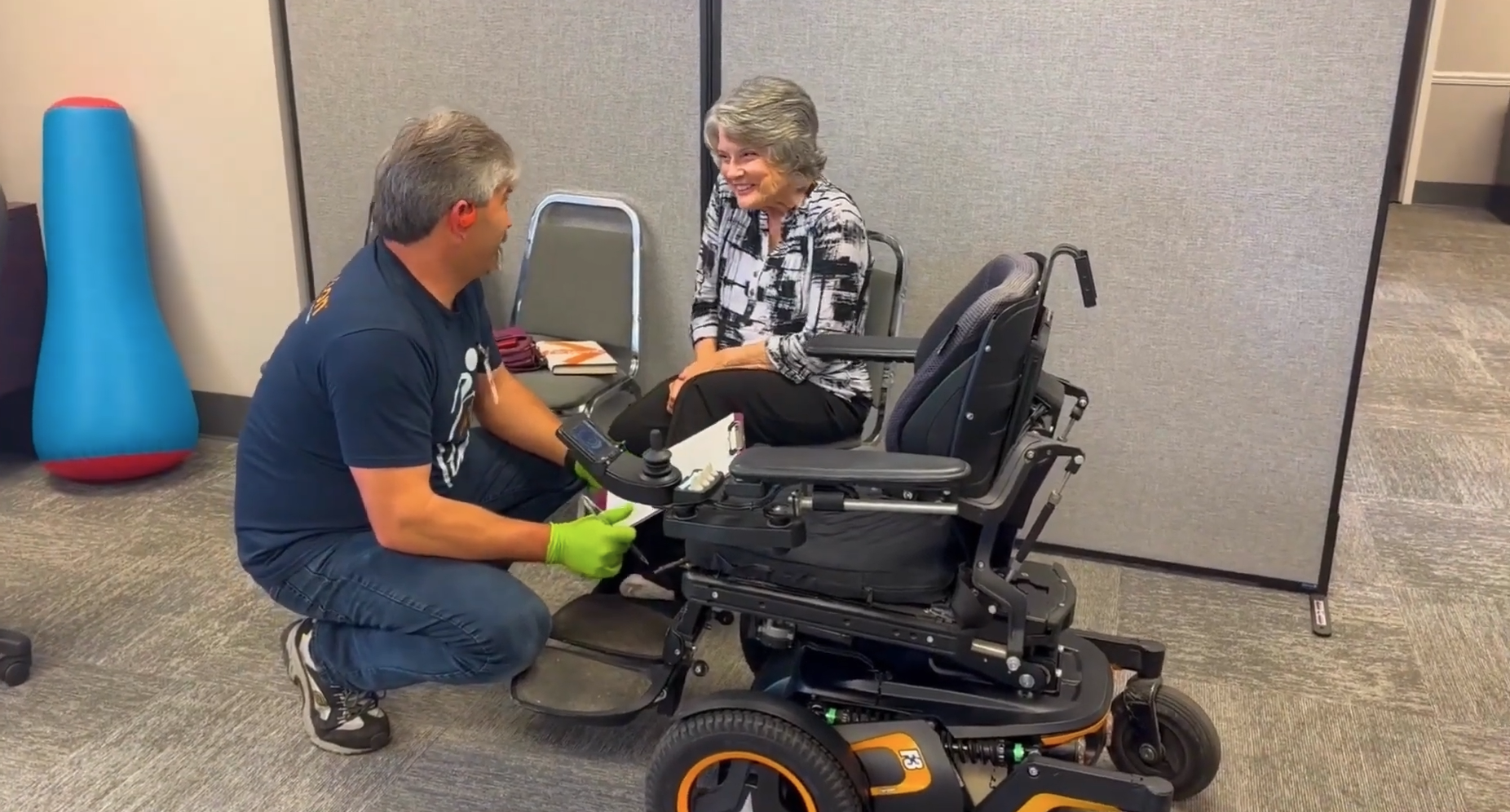 Technician repairing a chair for a customer